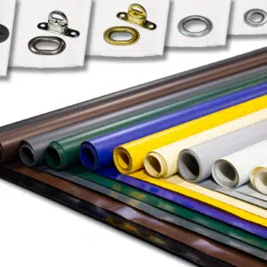 Rollen mit buntem Stoff für LKW Planen sind in einer mehrschichtigen Präsentation angeordnet und weisen Farbtöne wie Schwarz, Grün und mehr auf. Darüber sind verschiedene Ösen aus Metall und Kunststoff ausgelegt, die unterschiedliche Designs zeigen.
