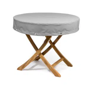 Das Bild zeigt eine runde Abdeckhaube in grauer Farbe, die auf einem holzfarbenen Hocker steht. Die Haube ist mit Rundösen versehen und steht vor einem weißen Hintergrund.